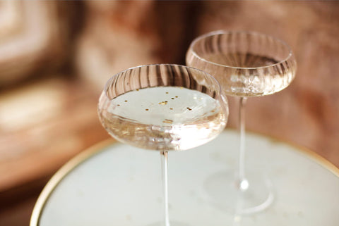 two champagne coupes