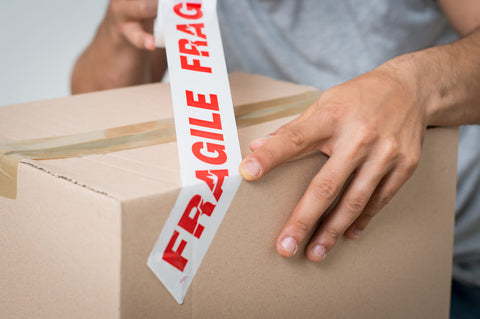 fragile label on moving box