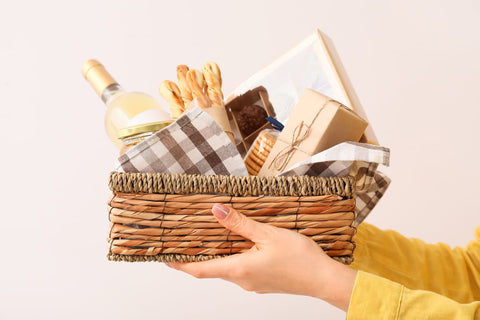 woman holding wine gift basket for mothers day