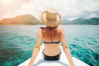 Woman sunbathing on a boat in the South Pacific Ocean