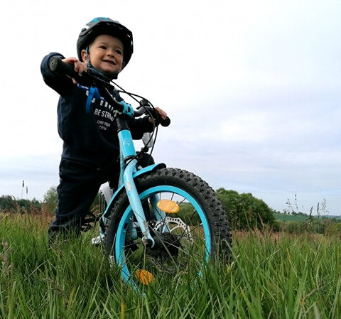 Child on a bike outside