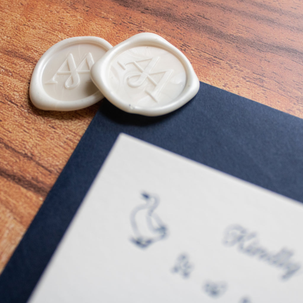 White wax seals, monogram design, letterpress wedding invitation