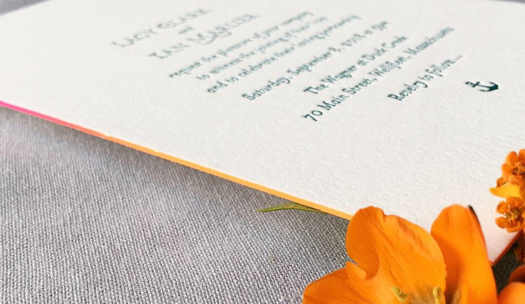 letterpress wedding invitation with ombré edge painting in orange and pink
