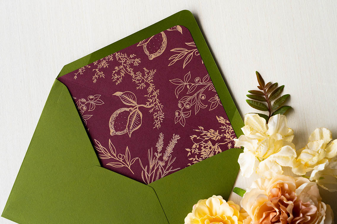 burgundy and tan envelope liner with custom, hand-drawn, botanical illustrations