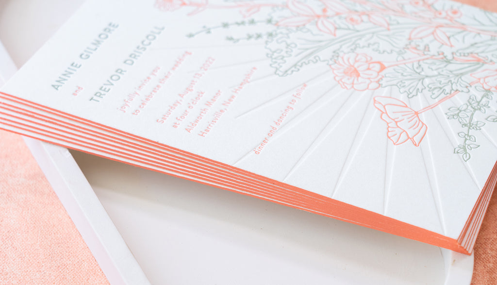 Letterpress wedding invitations with coral edge painting