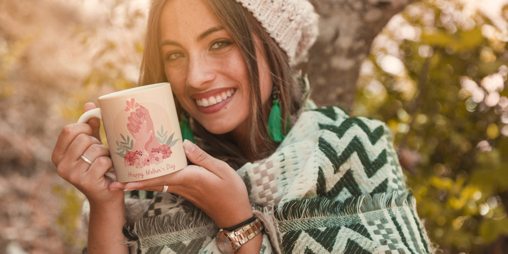 Woman holding a mothers day mug