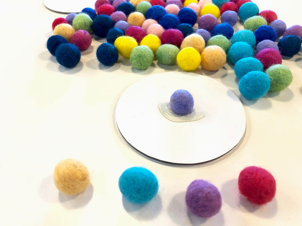 4 selected Wool Pom Poms