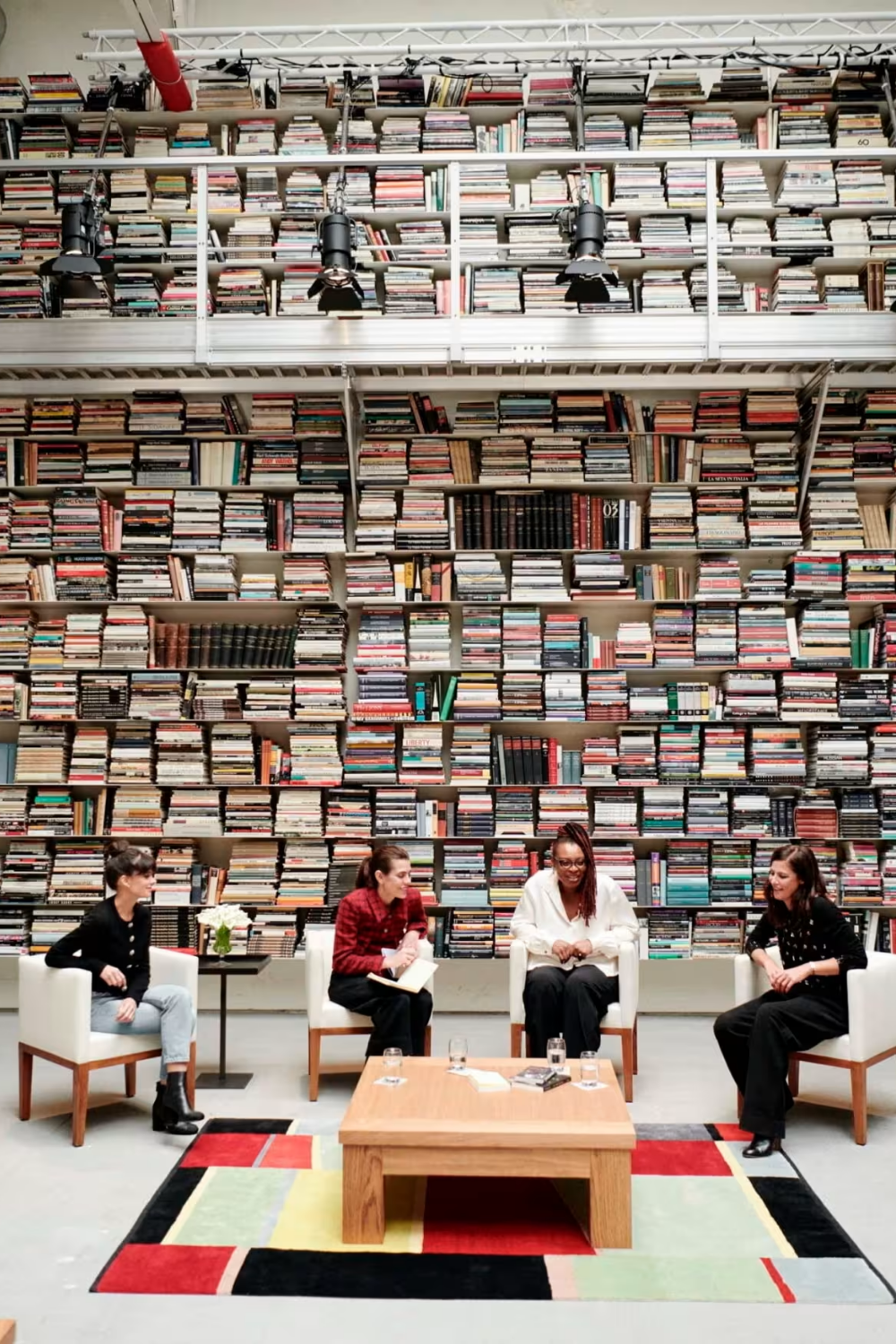 Chanel brand ambassador and actress Anna Mouglalis (second left) with author Léonora Miano (third left) at the 7L bookstore, founded by Karl Lagerfeld, on Rue de Lille in Paris