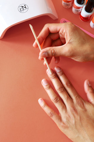 Pushing cuticles back with Prep & Remove Pusher