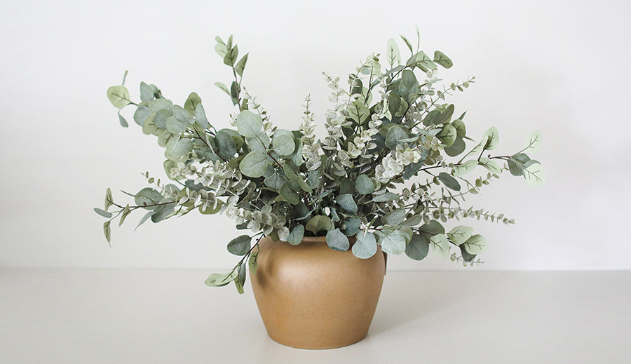 Artificial Eucalyptus Leaves Simply Styled in a Ceramic Vase