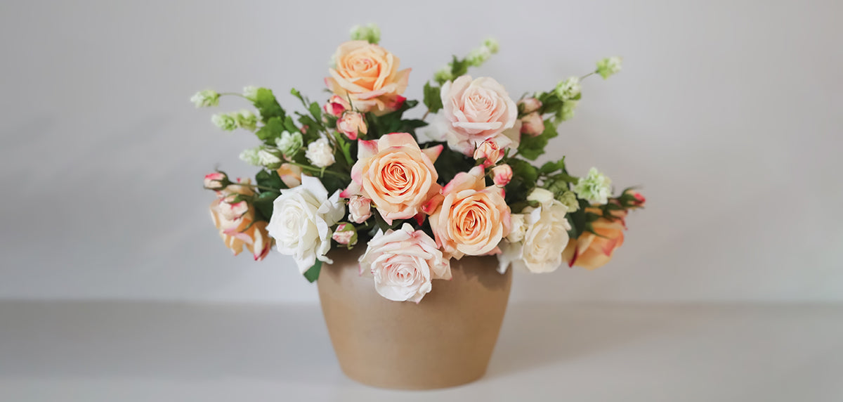 Real Touch Roses in Peach Tones Paired with Green Faux Hops