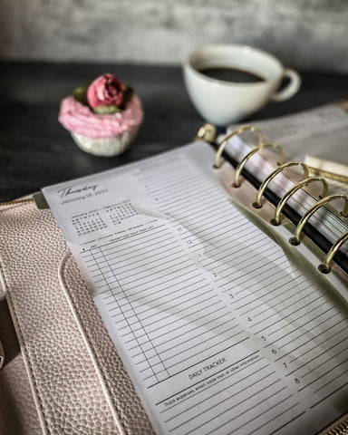 Close up of franklin planner Millie Binder with pink faux cupcake