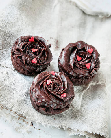 chocolate cupcakes on white cloth