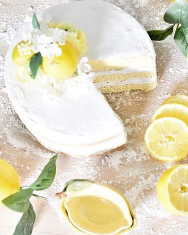 faux lemon cake with lemon slices surrounding