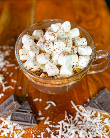 Jamaican Rum hot chocolate on wooden board with marshmallows 