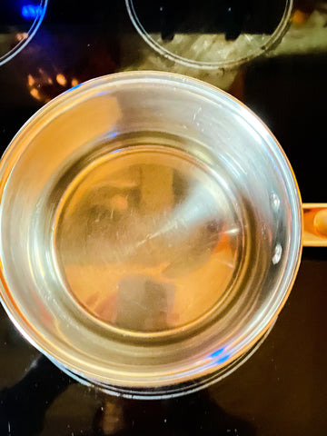 water boiling in small silver pot