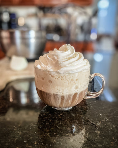Coffee Bar with cup of coffee topped with whipped cream