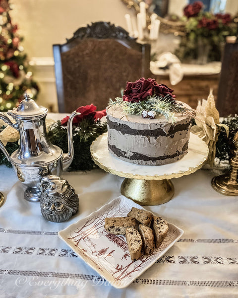 gold cake stand with chocolate faux naked cake topped with red roses