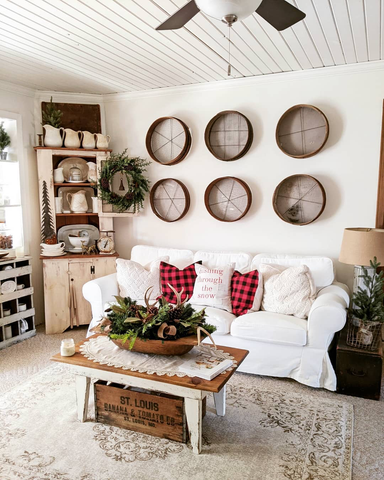 living room view white sofa with red Christmas pillows