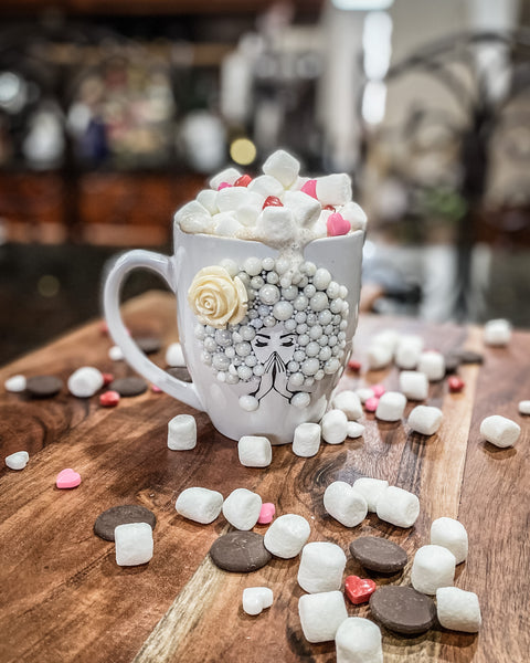 Afro glam Cup of cocoa with marshmallows chocolate and pink red and white heart candies