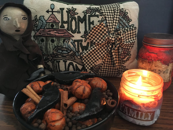 Primitve pumpkin and crow potpourri and candle decorations