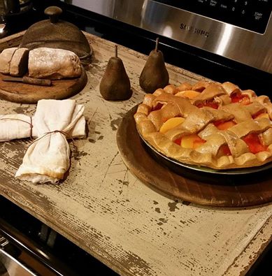 fake peach pie on kitchen stove
