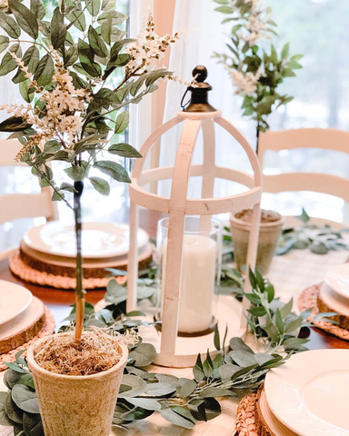 spring tablescape with topiaries and candles