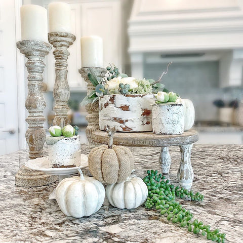 faux cakes with pumpkins and greenery