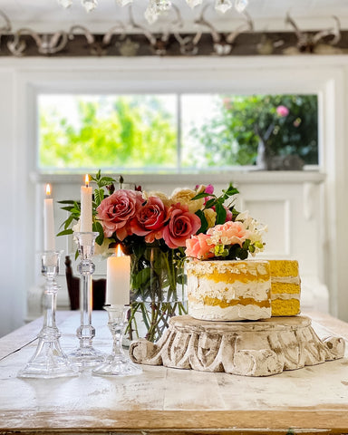 Faux Cake on table with red roses