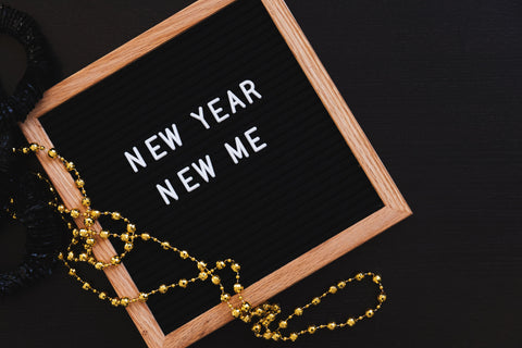 letter board with new year new me