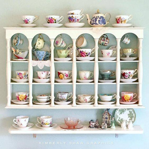 tea china on white wall shelf