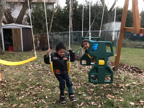 Ahmed (left) and his brother testing out the play structure for the first time. 
