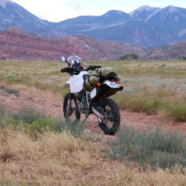 Motorcycle with luggage on the back.