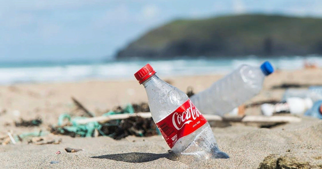 dirty beach full of plastic