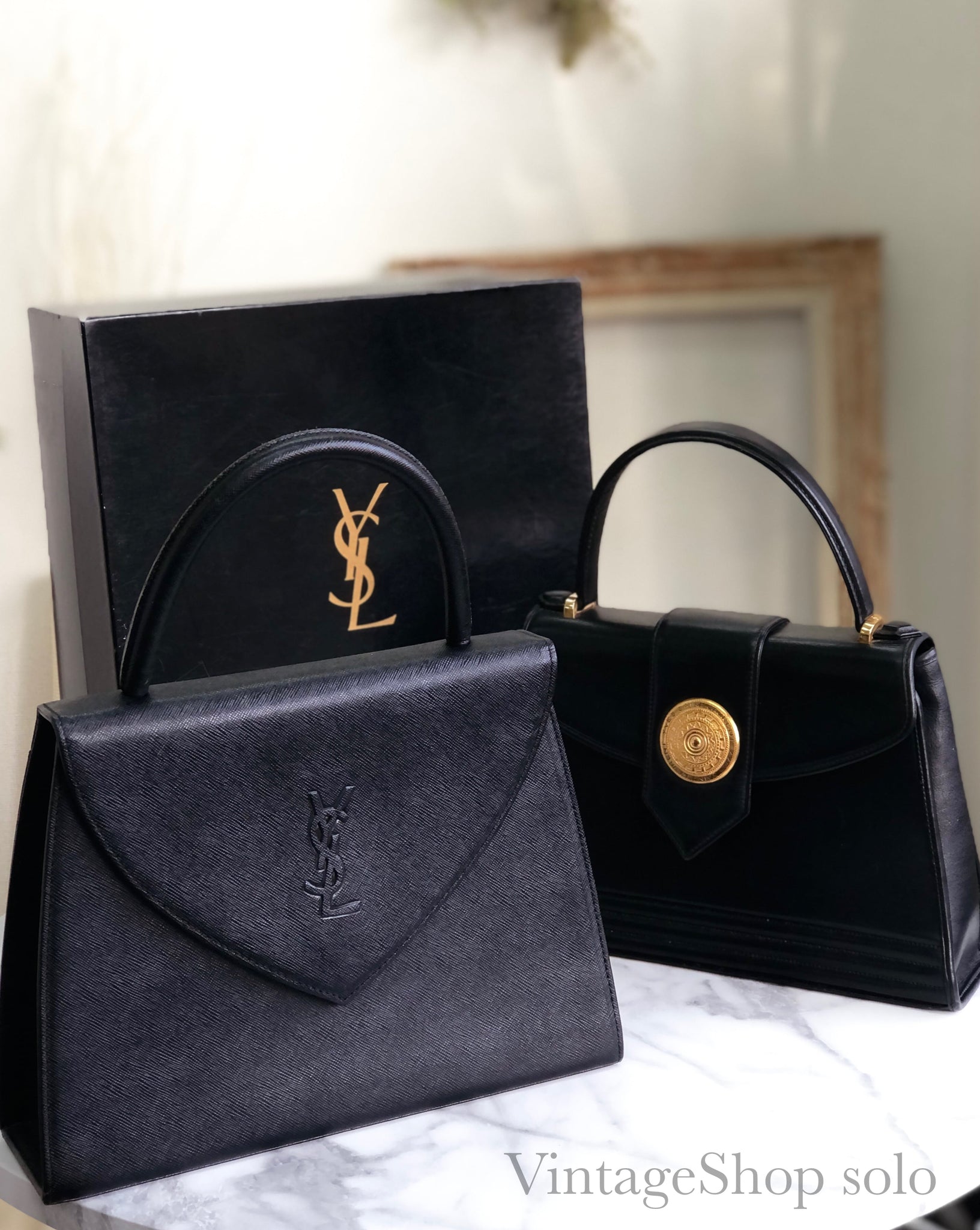 Yves Saint Laurent medal motif leather kelly type handbag black