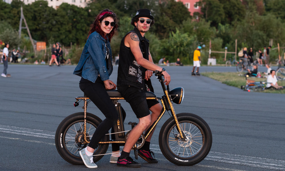 couple on reflective bicycle in tempelhof