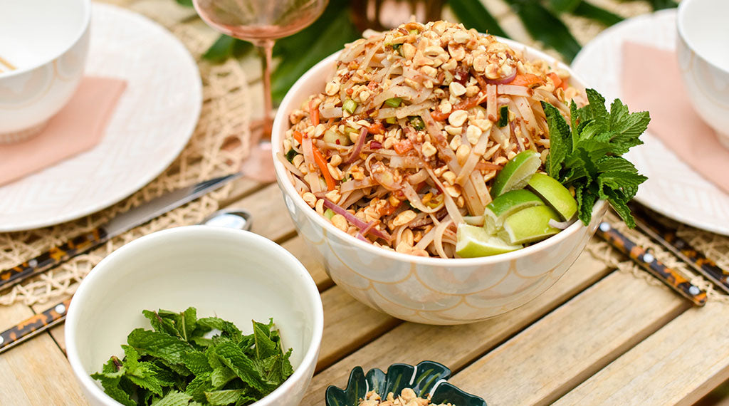 Sweet Chili Noodle Salad recipe served on a wooden table in a blush bowl