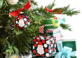 Ho Ho Santa Glass Ornament Displayed on a Christmas Tree with Gift Box