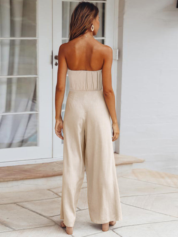 Featuring a flattering backless cut and a charming front bow tie.