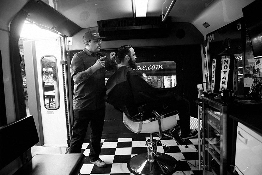 Man getting haircut in barbershop