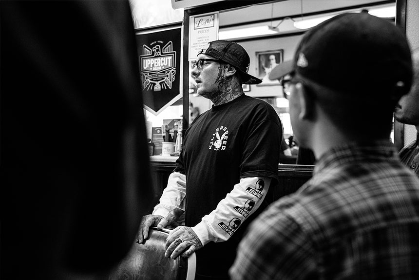 Man standing behind barber chair