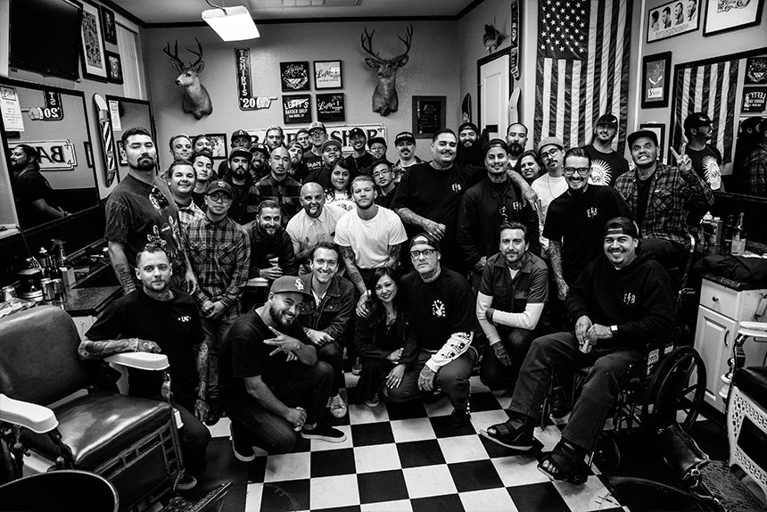 Many barbers posing together