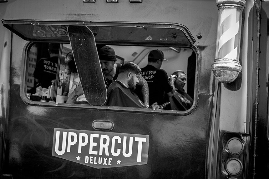 Barbershop window held open with skateboard