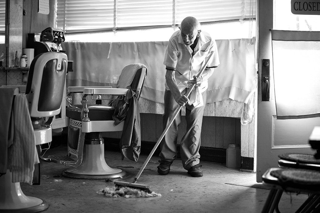 Man sweeping up hair