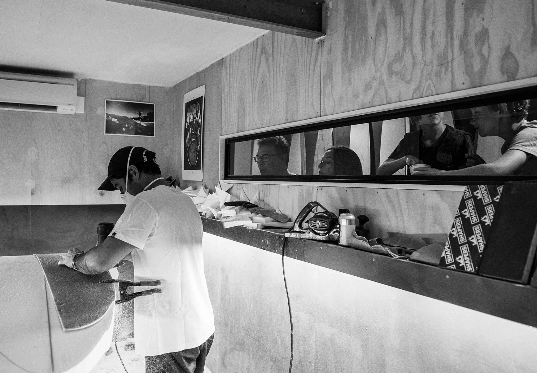 Man working on surfboard