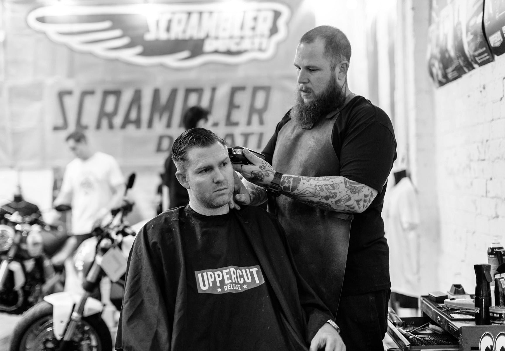 Barber cutting mans hair