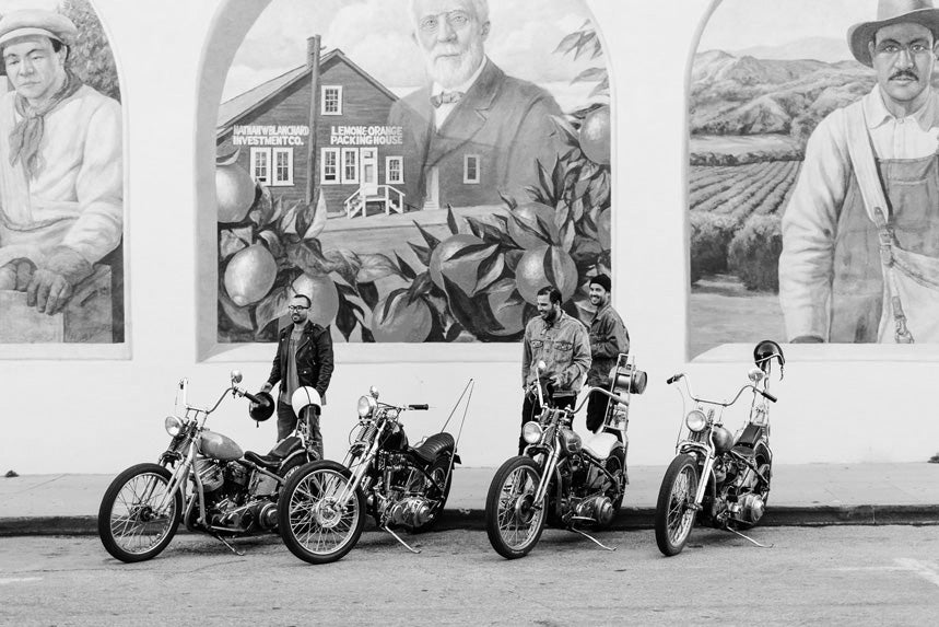 Men admiring motorbikes