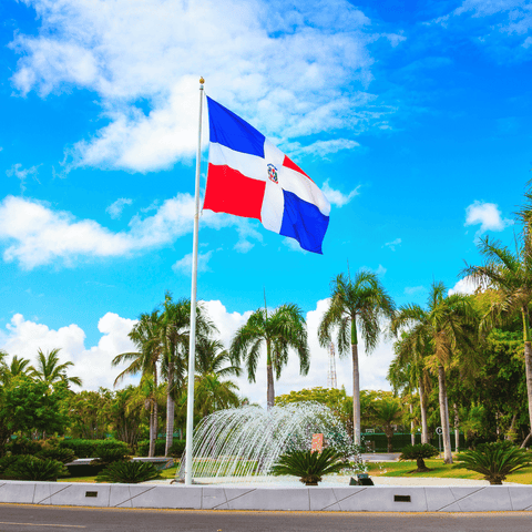 picture of dominican flag flying on beautiful day