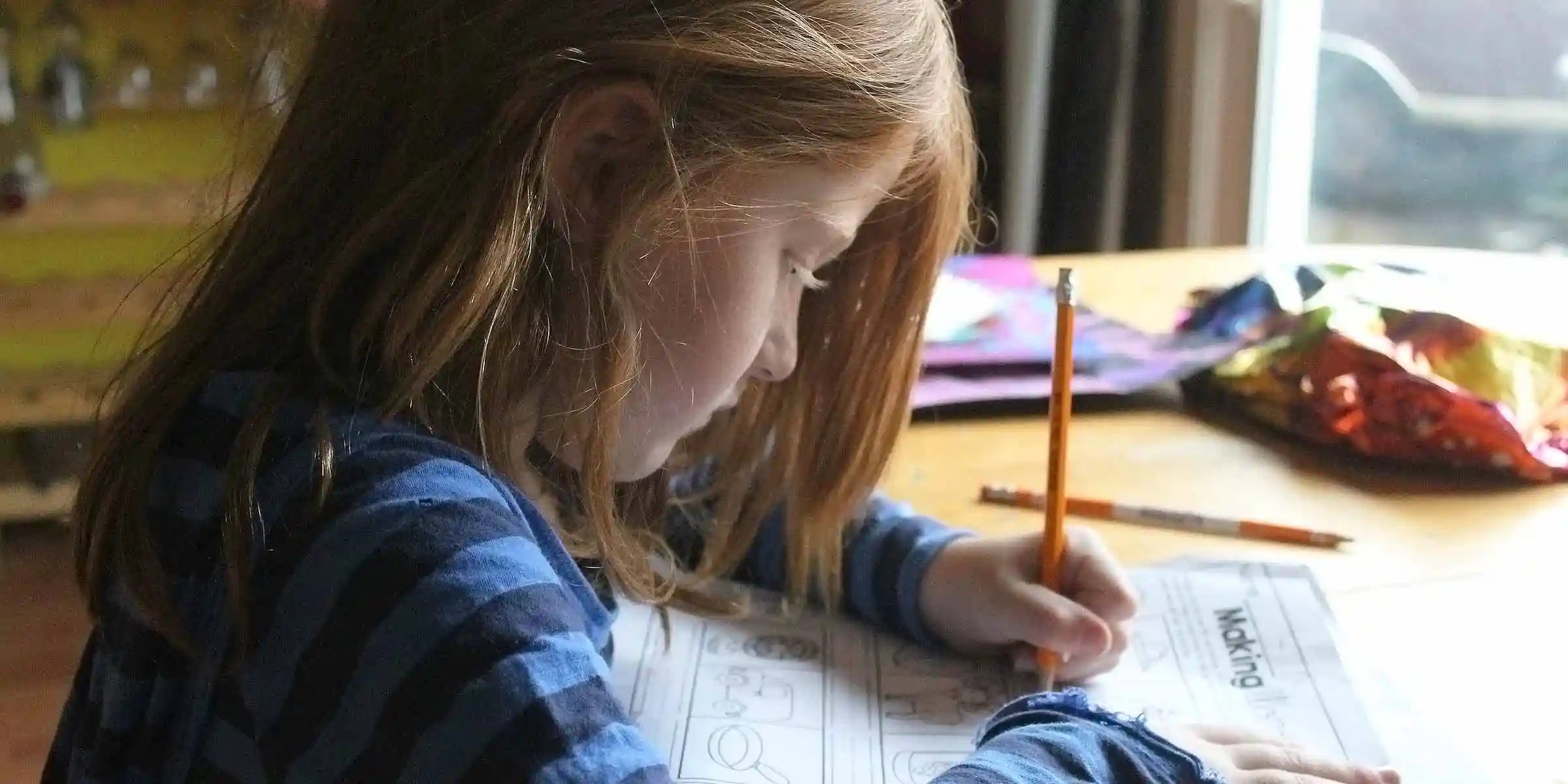 Girl writing on paper