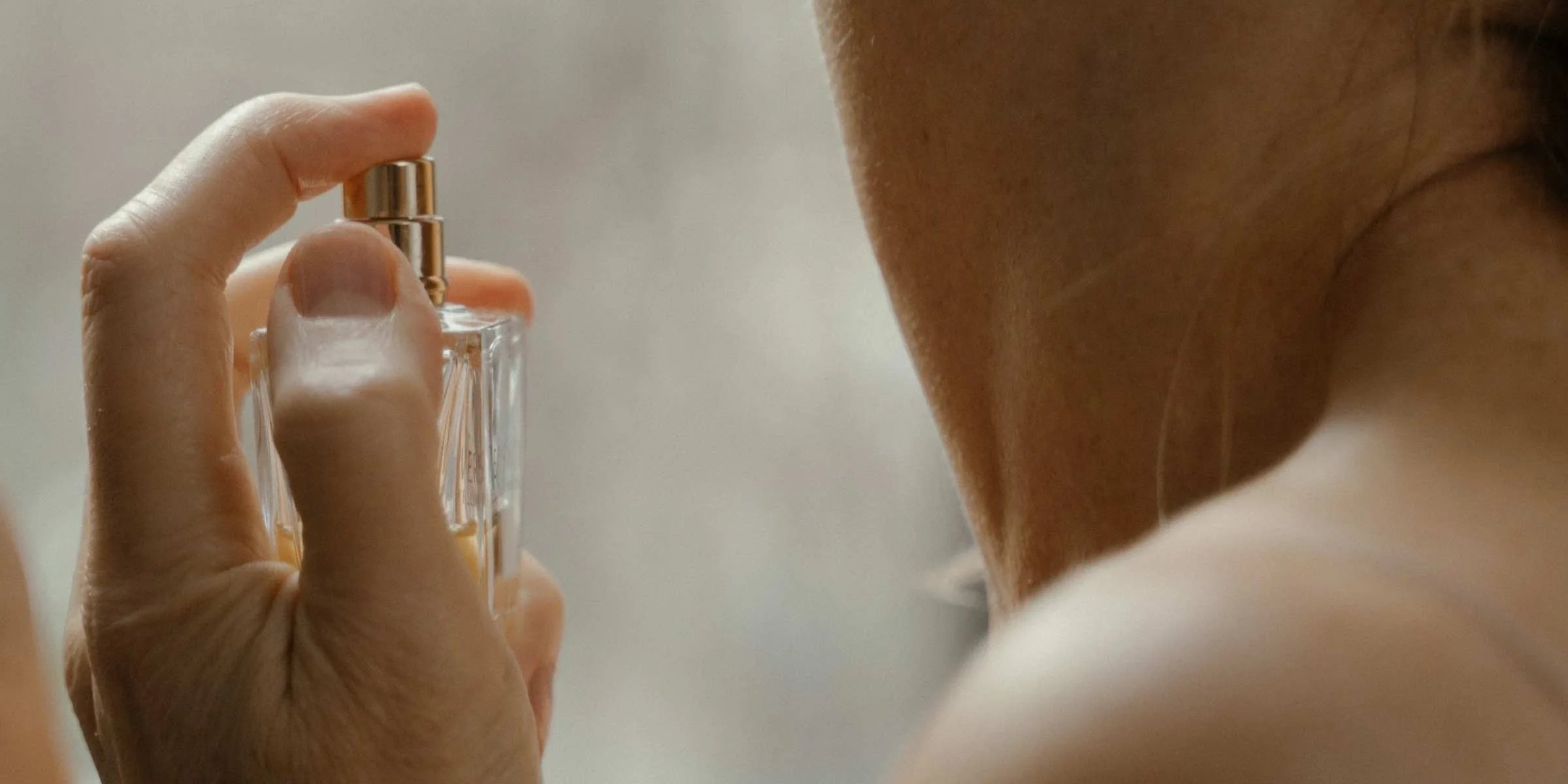 ION Skin Support Woman Spraying Perfume